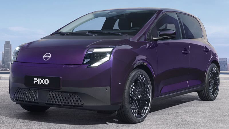Three-quarter front view of a purple Nissan PIXO electric city car parked beneath a modern concrete structure, with a city skyline in the background.